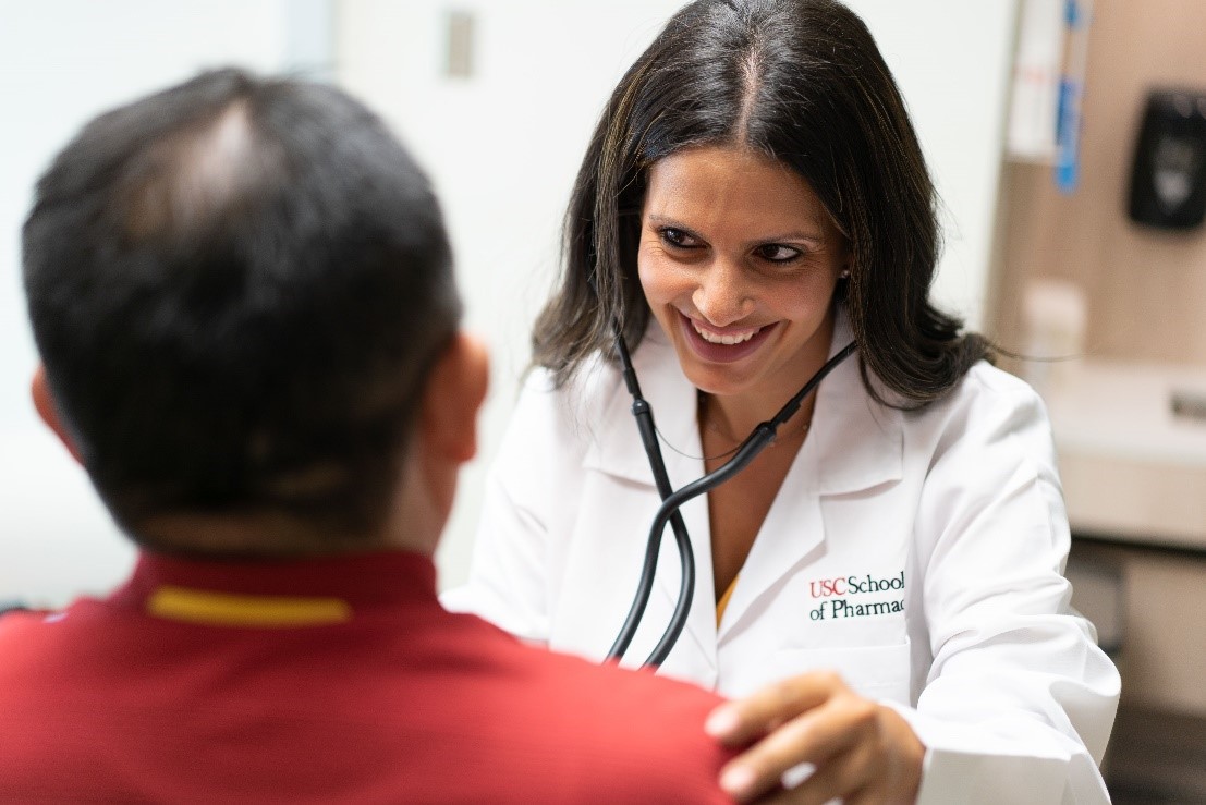 Dr. Jessica Abraham with a patient.