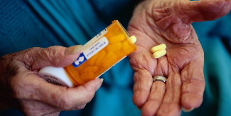 Man taking his prescription medication.